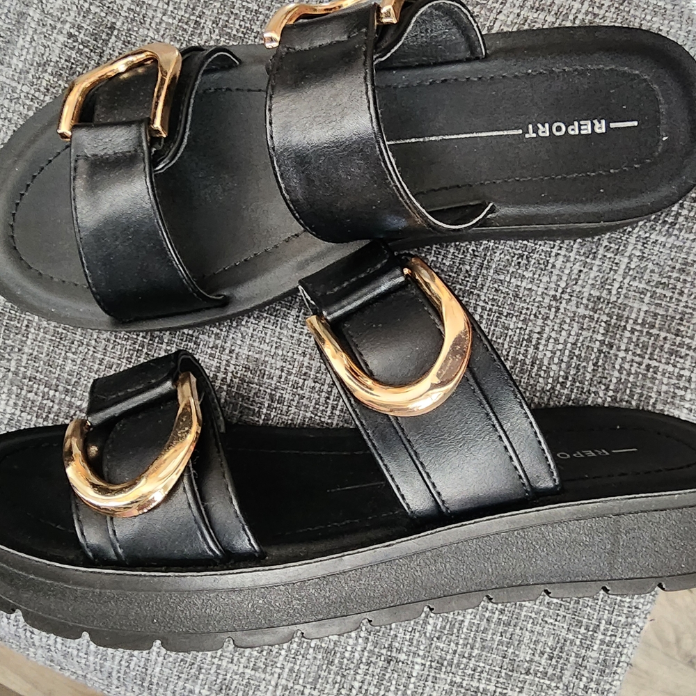Report Gold and Black Sandals with Metallic Buckles